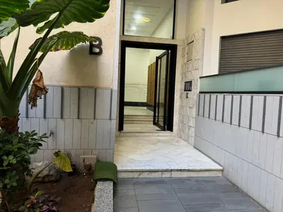 a hallway of a house with a door open at Studio Appartement MIRAMAR in Mohammedia