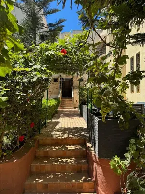 a set of stairs leading up to a building at Triplex à 5 min de la plage ! in Temara