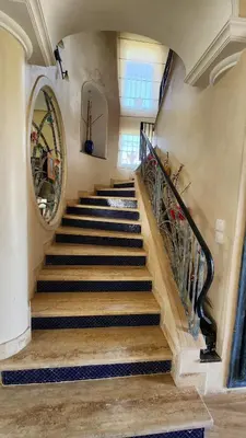 a staircase in a house with a stair case at Villa, piscine sans vis-à-vis in Casablanca
