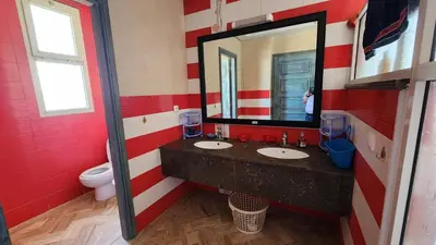 a bathroom with two sinks and a mirror at Villa, piscine sans vis-à-vis in Casablanca