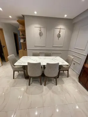 a dining room with a table and chairs at La Belle Vue Cosy Apartment in Casablanca