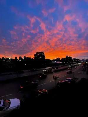 a busy city street with cars at sunset at La Belle Vue Cosy Apartment in Casablanca