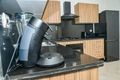 a kitchen with a mixer on a counter at Le Joyau du Parc in Mohammedia