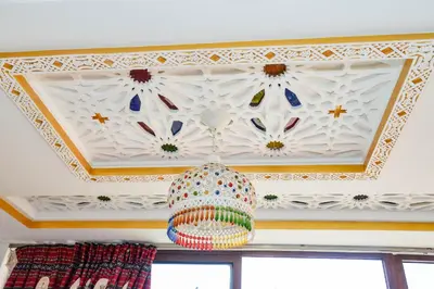 a room with a ceiling with a chandelier at MOHAMMEDIA Rico Flores in Mohammedia