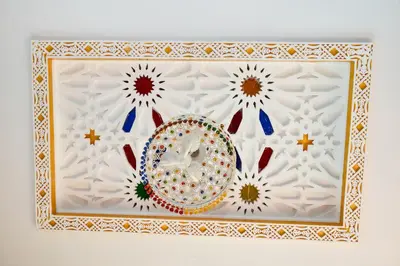 a framed picture of a plate and flowers at MOHAMMEDIA Rico Flores in Mohammedia