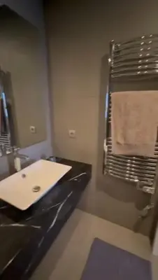 a bathroom with a sink and a mirror at Jasmine's house in Casablanca