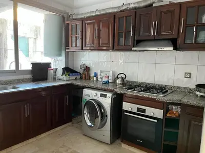 a kitchen with a washer and a washing machine at Elégance et confort au coeur de Casablanca in Casablanca