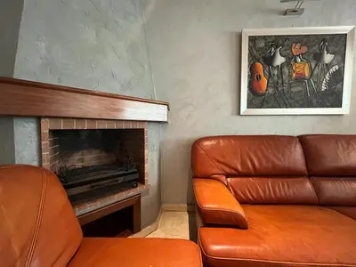 a living room with a couch and a fireplace at Elégance et confort au coeur de Casablanca in Casablanca