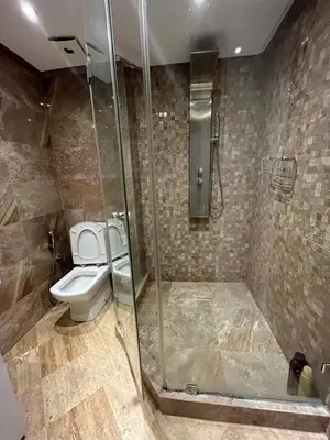 a bathroom with a toilet and a glass shower at Elégance et confort au coeur de Casablanca in Casablanca