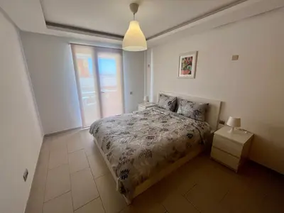 a bedroom with a bed and a window at Zen & Welcoming CFC - Garage & Tramway in Casablanca