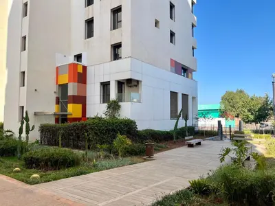 a building with a sidewalk in front of it at Zen & Welcoming CFC - Garage & Tramway in Casablanca