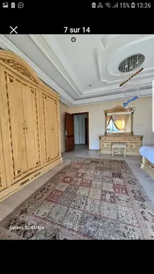 a large room with a large rug on the floor at Villa de vacances à Hay Riad in Rabat