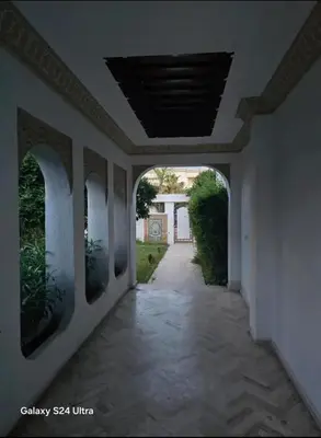 an empty hallway in a house with an archway at Villa de vacances à Hay Riad in Rabat