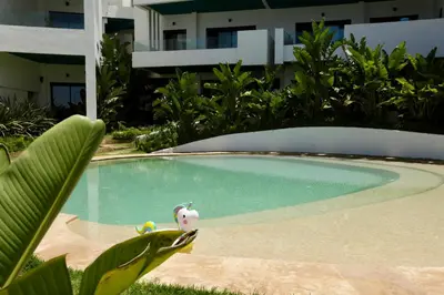 a small swimming pool with a stuffed animal in it at Magnifique appartement front mer in Tamaris