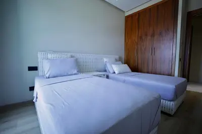 two beds in a room with two beds sidx sidx sidx at Magnifique appartement front mer in Tamaris