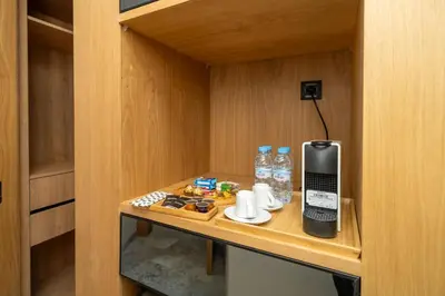 a room with a phone on a wooden table at Twenty Four Inn 306 in Casablanca