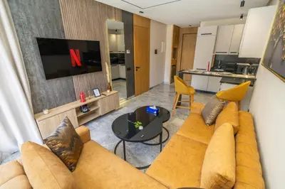 a living room with a couch and a table at Twenty Four Inn 302 in Casablanca