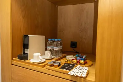 a room with a counter with a coffee maker and a microwave at Twenty Four Inn 302 in Casablanca