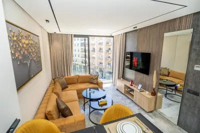 a living room with a couch and a tv at Twenty Four Inn 302 in Casablanca