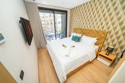 a bedroom with a bed with two shoes on it at Twenty Four Inn 302 in Casablanca