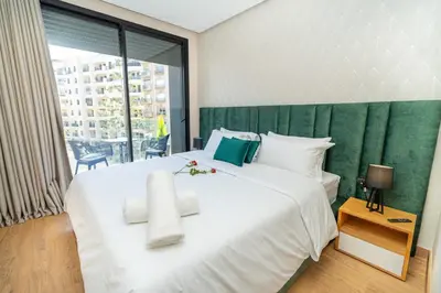a bedroom with a large white bed and a window at Twenty Four Inn 304 in Casablanca