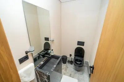 a bathroom with two toilets and a mirror at Twenty Four Inn 305 in Casablanca