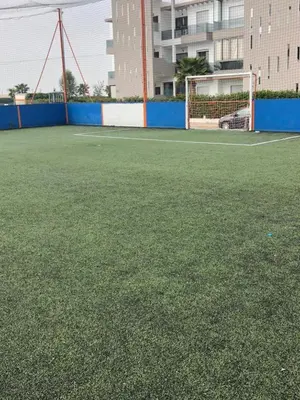 a soccer field with a net and a goal at Appartement Sidi Rahal in Berrechid
