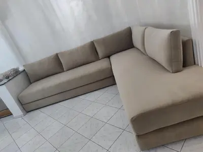 a brown couch sitting in a living room at Appartement de standing in Casablanca