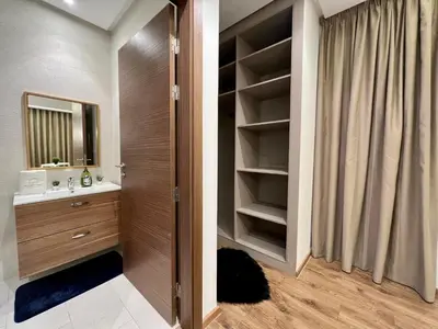 a bathroom with a sink and a mirror at Casa Financial City 2 Bedrooms - Appartali Luxury Platform in Casablanca