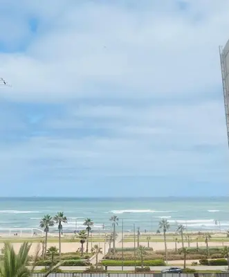 a view of the ocean from the balcony of a beach at Ocean Apartments in Casablanca