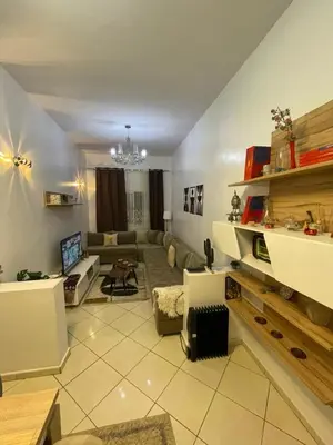 a living room with a couch and a table at Chez vous à Skhirate in Skhirat