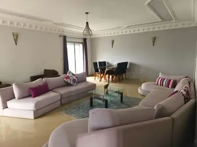 a living room with two couches and a table at Elegant appartement de 2 chambres sur bd Anfa in Casablanca