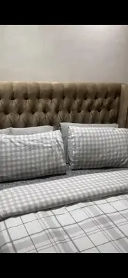 a bench with two pillows on it in a room at Charmant appartement in Casablanca