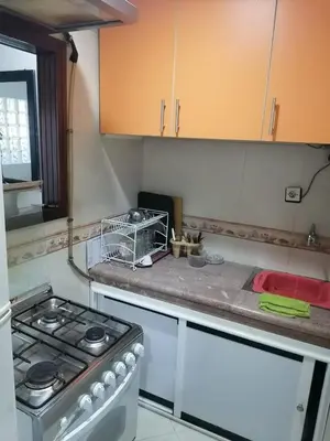 a kitchen with a stove and a sink at Studio Avenue de France in Rabat