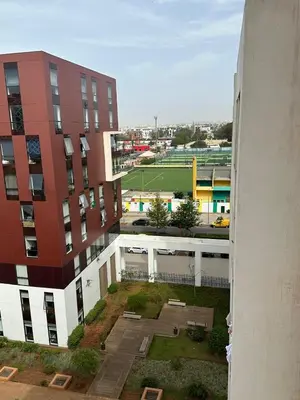 a view of a tennis court from a building at Appartement Casa Finance City in Casablanca