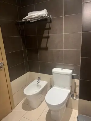a bathroom with a toilet and a sink at Appartement Casa Finance City in Casablanca