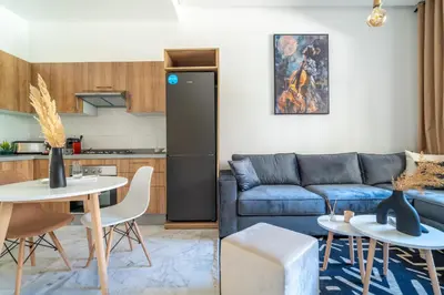 a living room with a couch and a table at AeroStay in Nouaceur