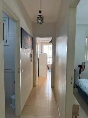 a hallway with a hallway leading to a room at Garsoniere Borj in Rabat