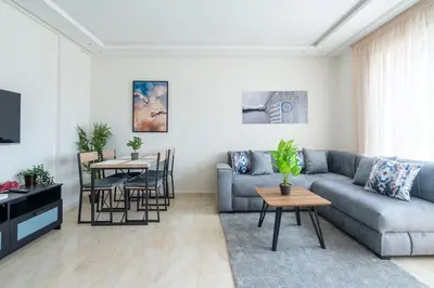 a living room with a couch and a table at Superbe appartement à Casablanca in Casablanca