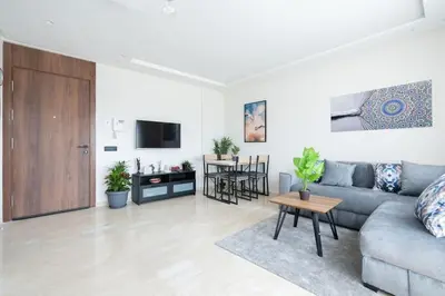 a living room with a couch and a table at Superbe appartement à Casablanca in Casablanca