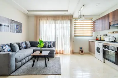a living room with a couch and a table at Superbe appartement à Casablanca in Casablanca