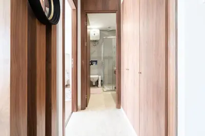 a hallway of a bathroom with a toilet and a sink at Superbe appartement à Casablanca in Casablanca