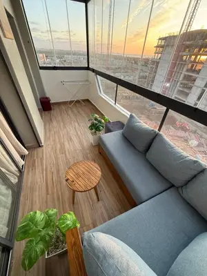 a living room with a couch and a table at Appartement a zenata ain-harrouda casablanca in Mohammedia