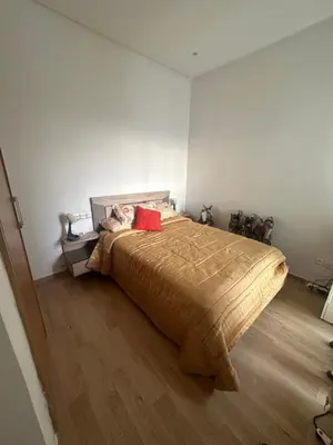 a bedroom with a large bed in a room at Appartement 2 Chambres in Sidi Rahal