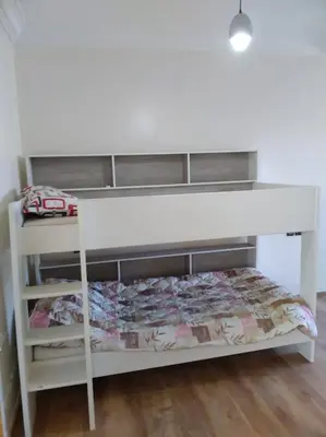 a white bunk bed in a room at Villa avec piscine, Hacienda Beach Sidi Rahal in Sidi Rahal