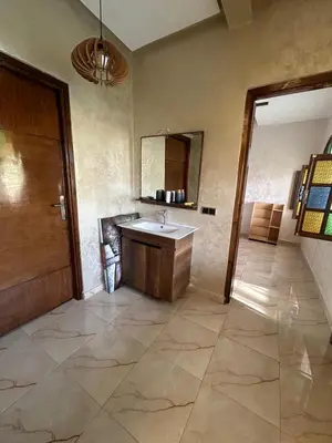 a bathroom with a sink and a mirror at Villa Ines avec piscine privée in Sidi Moussa Ben Ali