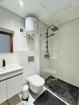 a bathroom with a shower and a toilet and a sink at Oasis 9 Cozy studio in Downtown Maarif in Casablanca