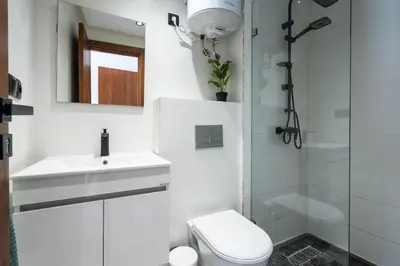 a bathroom with a toilet and a sink and a shower at Oasis 9 Cozy studio in Downtown Maarif in Casablanca