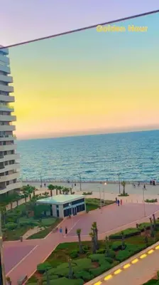 a view of a beach with a building and the ocean at Marina Ocean Suite - By Appart'Ayla in Casablanca