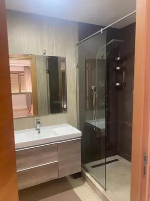 a bathroom with a sink and a shower at Villa avec piscine Mohammedia in Mohammedia